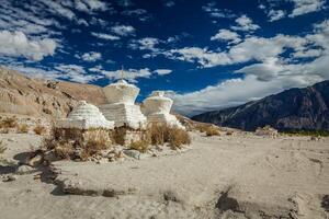 Chortens Tibetan Buddhism stupas in Himalayas. Nubra valley, L photo