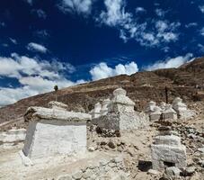 Chortens Tibetan Buddhism stupas in Himalayas. Nubra valley, Ladakh, India photo