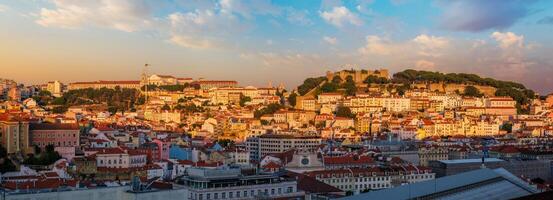 View of Lisbon from Miradouro de Sao Pedro de Alcantara viewpoint on sunset. Lisbon, Portugal photo