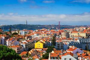 View of Lisbon from Miradouro dos Barros viewpoint with clouds. Lisbon, Portugal photo