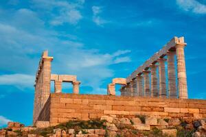 Poseidón templo restos en capa sounio en atardecer, Grecia foto