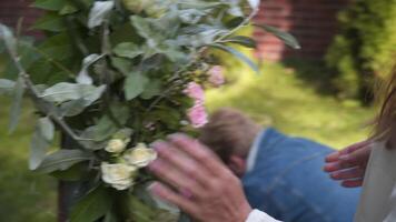 Staff event agency at work. Florists mount, decorate flowers arch for wedding ceremony. Work creating wed decor by professional. Floristics. Decorator working with flowers composition for wedding arch video