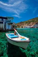 The beach of Firapotamos in Milos, Greece photo