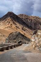 Road in Himalayas with mountains photo