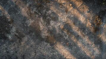 A top-down photography of a dirty driveway with a concrete texture. photo