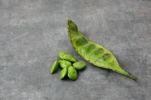 Pete or Petai or stink bean, usually eaten raw or for other cooking ingredients. photo