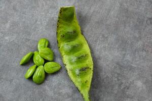 Pete or Petai or stink bean, usually eaten raw or for other cooking ingredients. photo