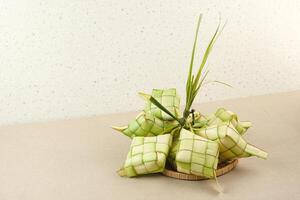 Ketupat or rice dumpling, natural rice casing made from young coconut leaves for cooking rice. Popular during Eid al-Fitr in Indonesia. photo