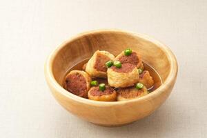 Gohyong or Ngo Hiang, made from minced chicken with flour, served with sour sauce photo