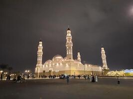 Madinah, Saudi Arabia, 12 April 2024 - Beautiful nighttime outdoor view of Quba Mosque Madinah in dark clouds and rain. photo