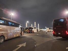 Madinah, Saudi Arabia, 12 April 2024 - Beautiful nighttime outdoor view of Quba Mosque Madinah in dark clouds and rain. photo