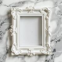 A white picture frame with an empty space inside, sitting on top of a marble surface. photo