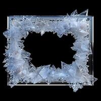 A large, thin rectangular frame made out of a clear, solid white diamond geode cluster. photo