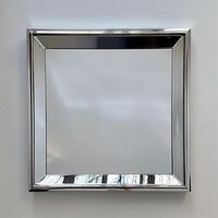 A square mirrored chrome frame with rounded bevel. photo