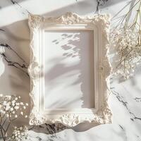 A white picture frame with an empty space inside, sitting on top of a marble surface. photo