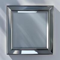 A square mirrored chrome frame with rounded bevel. photo