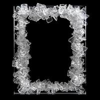 A large, thin rectangular frame made out of a clear, solid white diamond geode cluster. photo