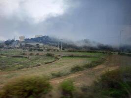 Breathtaking natural beauty of Abha in Saudi Arabia in the summer season. High mountains, greenery, low clouds and fog are the beauty of Abha. photo