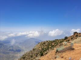 Breathtaking natural beauty of Abha in Saudi Arabia in the summer season. High mountains, greenery, low clouds and fog are the beauty of Abha. photo