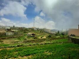 Breathtaking natural beauty of Abha in Saudi Arabia in the summer season. High mountains, greenery, low clouds and fog are the beauty of Abha. photo