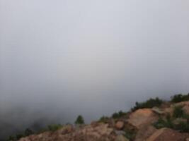 Breathtaking natural beauty of Abha in Saudi Arabia in the summer season. High mountains, greenery, low clouds and fog are the beauty of Abha. photo