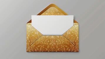 An envelope with gold foil on it, with the top open placed against a gray background. photo