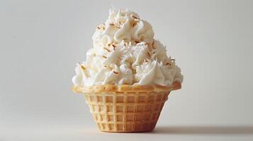 A white ice cream sundae in a waffle cup, topped with coconut flakes, on a plain white background. photo