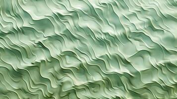 A texture of ripples on sand, with small waves on the surface, light green tint. photo