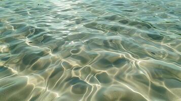 A texture of ripples on sand, with small waves on the surface, light green tint. photo