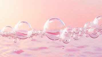 Flowing water bubbles in light pink gradient on minimalistic background. photo