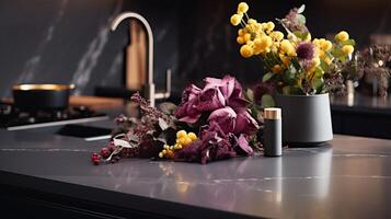 A Black Table Top With a Vase of Flowers. photo