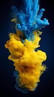 Blue and yellow acrylic colors and ink in water. Abstract background. photo