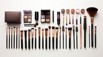 Set of Makeup Brushes and Cosmetics on White Surface. photo