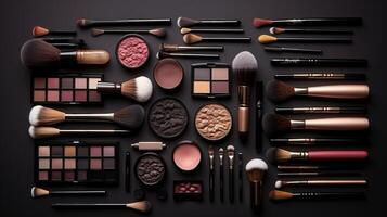 Makeup Cosmetics and Brushes Arranged on Black Surface. photo