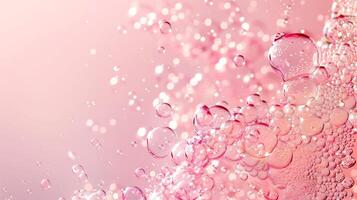 Flowing water bubbles in light pink gradient on minimalistic background. photo