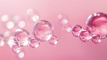 Flowing water bubbles in light pink gradient on minimalistic background. photo