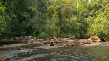 Caucasian Woman Practices Meditation In Tropical Rainforest, Thailand. video