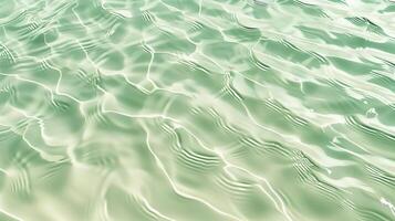 un textura de ondas en arena, con pequeño olas en el superficie, ligero verde tinte. foto