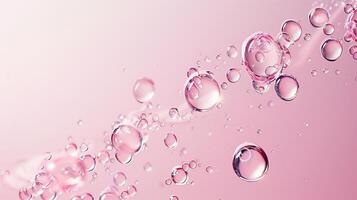 Flowing water bubbles in light pink gradient on minimalistic background. photo