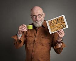 senior man with Good Morning Monday sign photo