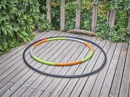 weighted hula hoops on a backyard deck photo