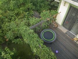 mini fitness trampoline and exercise ball in backyard patio photo