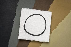 open Japanese enso symbol on white handmade paper photo