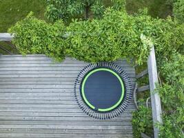 mini fitness trampoline in backyard patio photo