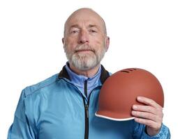 portrait of a senior cyclist with a helmet photo