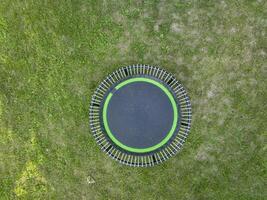 mini fitness trampoline in backyard photo