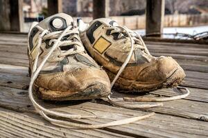 old muddy running shoes photo