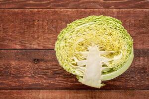 savoy cabbage on rustic wood photo