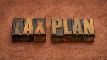 tax plan, financial concept, words in vintage letterpress wood type, business and tax optimization photo