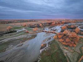 springtime sunrise over Platte River, crane viewing deck and plains near Kerney, Nebraska photo